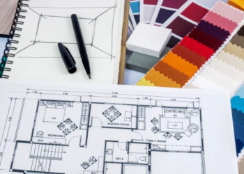 Home layouts and paint options spread out on a table.