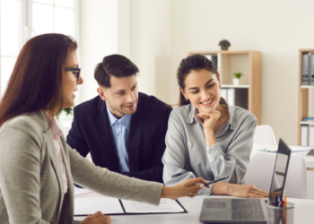 Couple meeting with real estate agent.