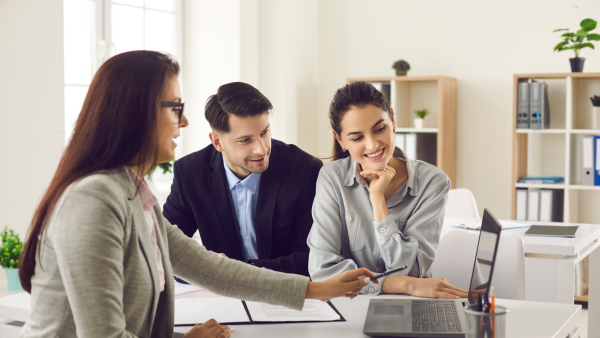 Couple meeting with real estate agent.