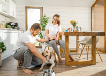 Couple at home with dog