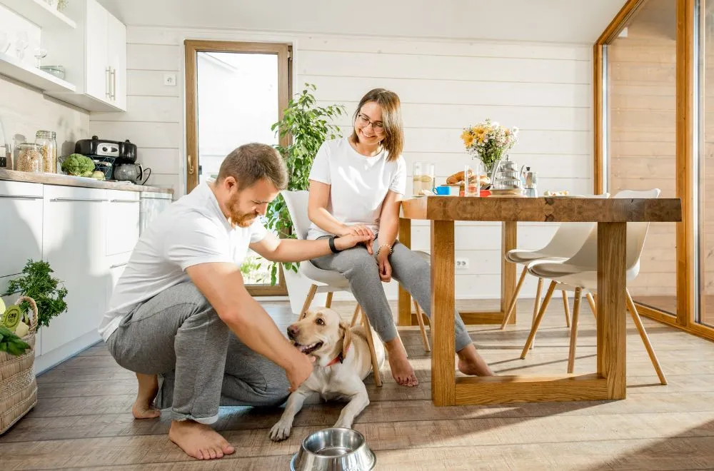 Couple at home with dog