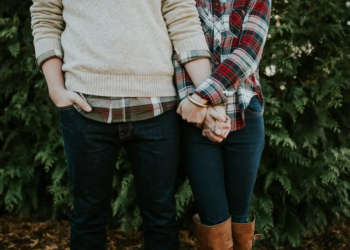 couple holding hands outdoors