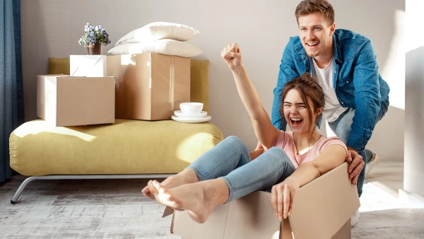 A happy couple moving into a home