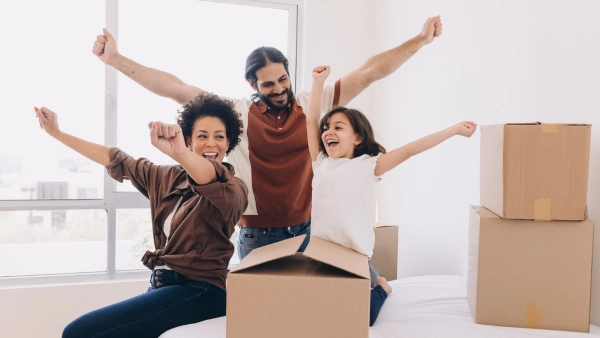 A happy family with moving boxes