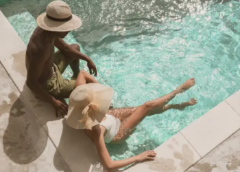 Couple lounging in pool