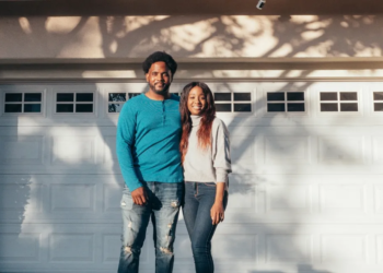 couple in front of garage