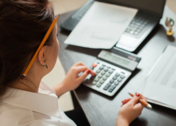 A woman using a calculator