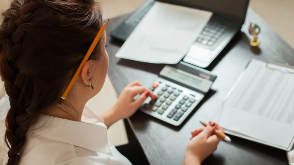 A woman using a calculator