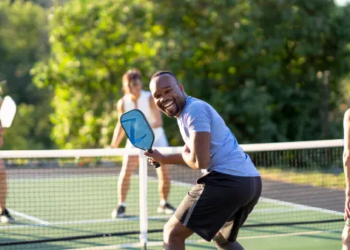 Smiling pickleball player and friends