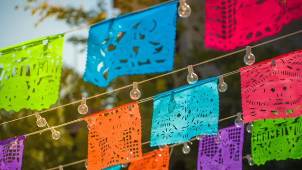Traditional colourful paper mexican banner with string lights