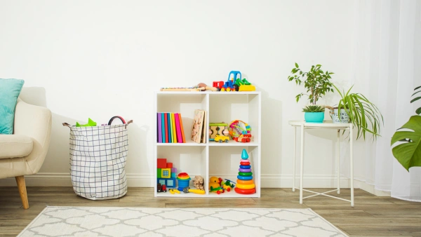 An image of a child's playroom that has proper toy organization in place