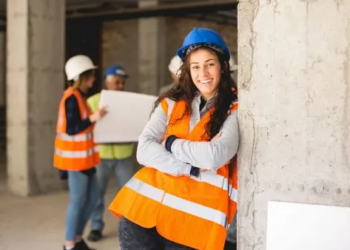 Construction worker smiling on job site