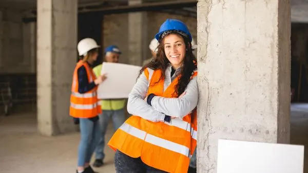 Construction worker smiling on job site