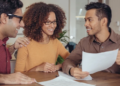 A couple discusses finances with a mortgage broker
