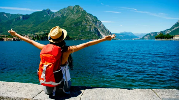 A female traveler looking out on an ocean view.
