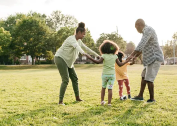 A family playing outside together