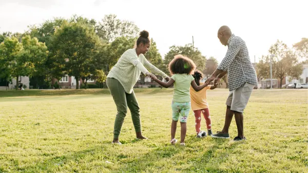 A family playing outside together