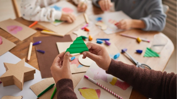 Kids making crafts together at a table