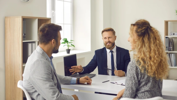 A couple talks with a mortgage broker