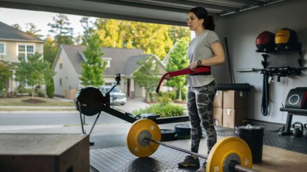 person in their home gym working out