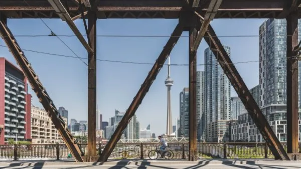 Man biking on bridge in Toronto
