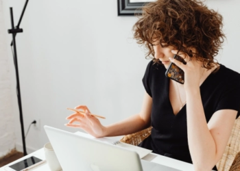 woman working on her desk at home