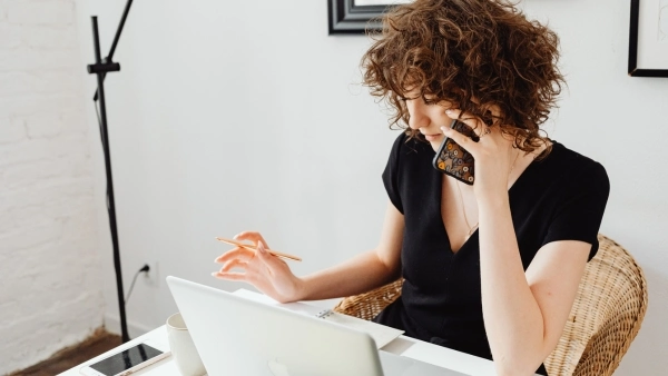 woman working on her desk at home