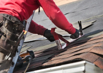 person adding roof