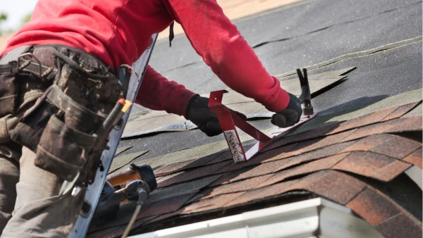 person adding roof