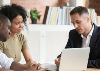 Couple speaking with agent