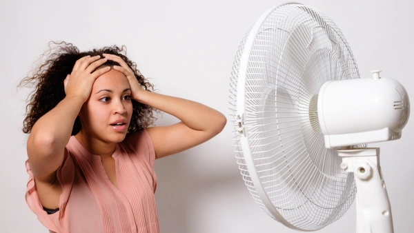 woman in front of fan