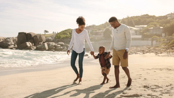 A family walking on the beach