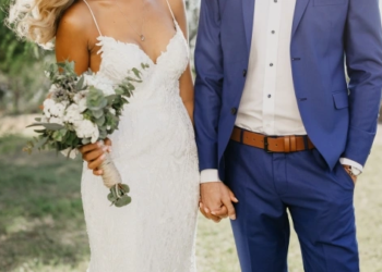 bride and groom holding hands