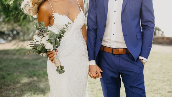 bride and groom holding hands