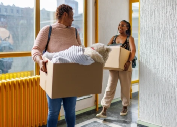 Two young people moving in together