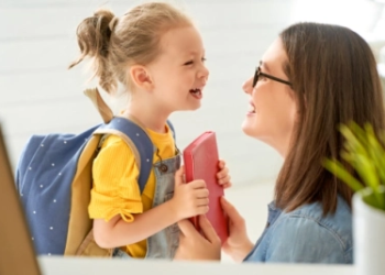 A child and parent preparing for back-to-school