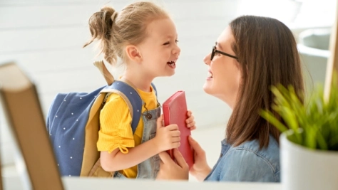 A child and parent preparing for back-to-school