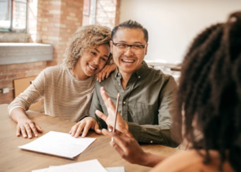 A couple talks with a mortgage lender