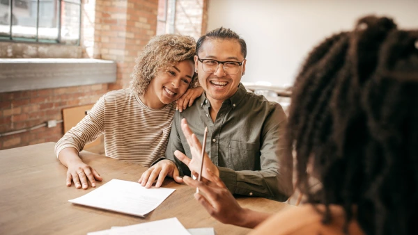 A couple talks with a mortgage lender