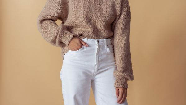 woman posing in a brown sweater