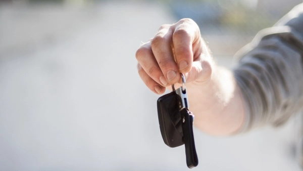 person holding car keys