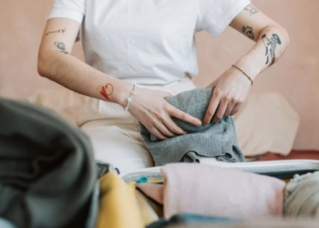 Woman putting clothes away