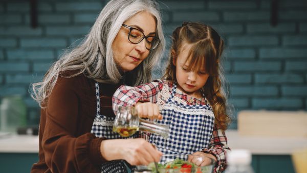 grandma cooking with grandchild