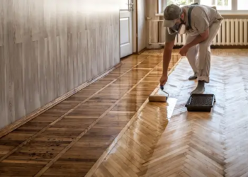 Someone protecting their hardwood floors.