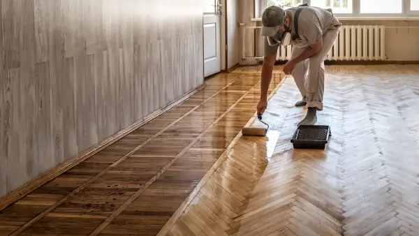 Someone protecting their hardwood floors.