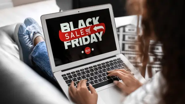 A laptop that displays "Black Friday Sales".