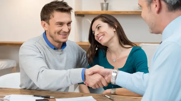 Two people shaking hands.