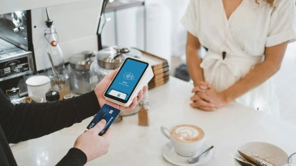 Paying for coffee at a coffee shop