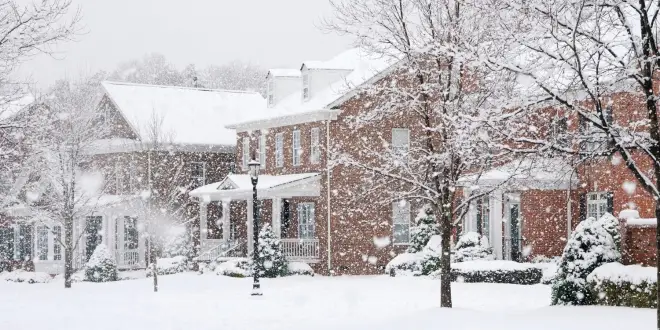 A snowy neighborhood of homes