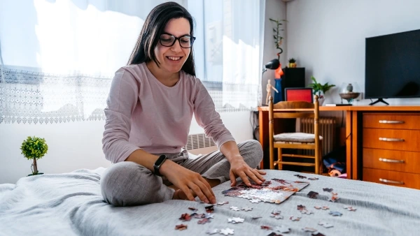 woman doing a puzzle